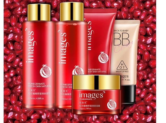 Images skincare products on a red background with pomegranate seeds