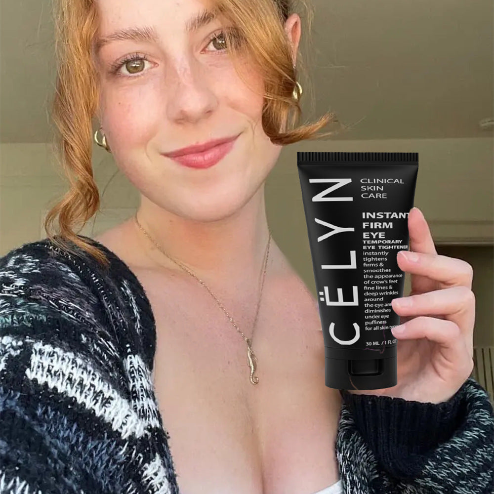 Woman holding a Celyn skincare product with a neutral background