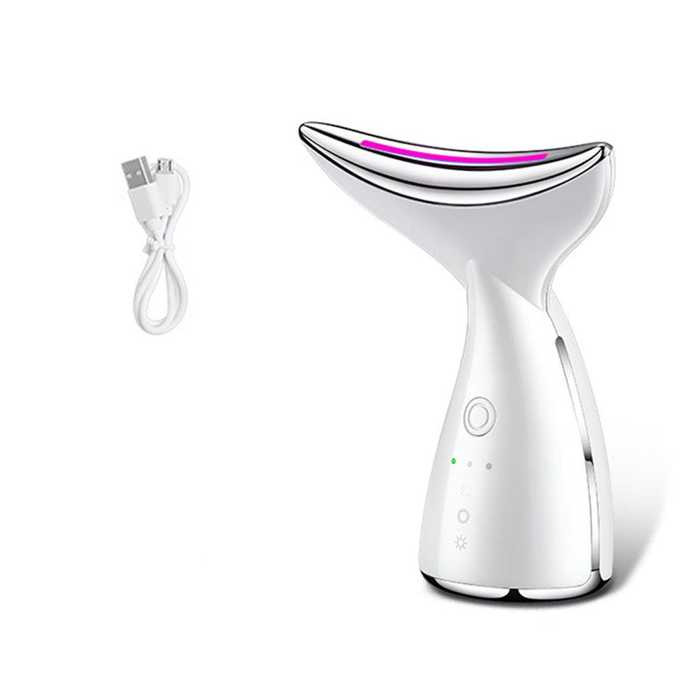 White facial steamer with USB cable and user manual on a white background