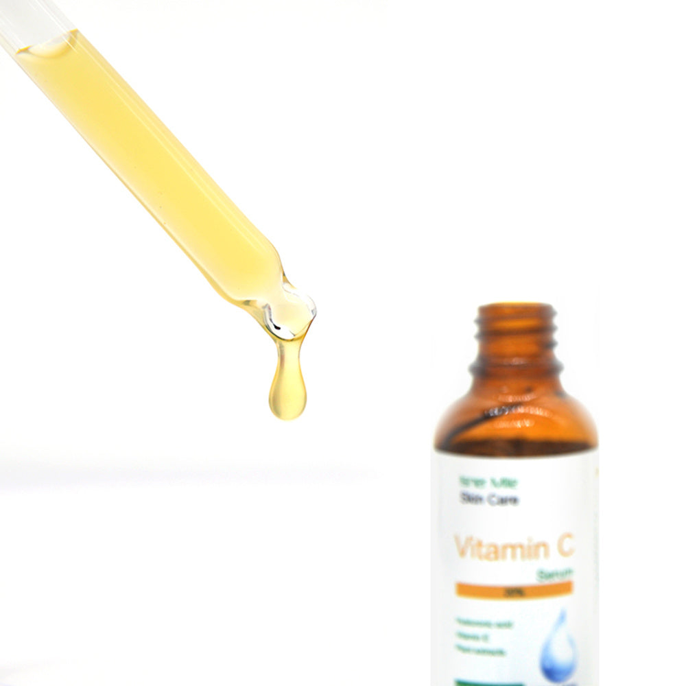 Vitamin C serum bottle with dropper on a white background