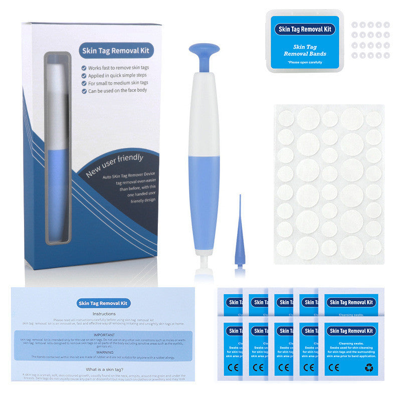 Skin tag removal kit with device, packaging, and supplies on a white background