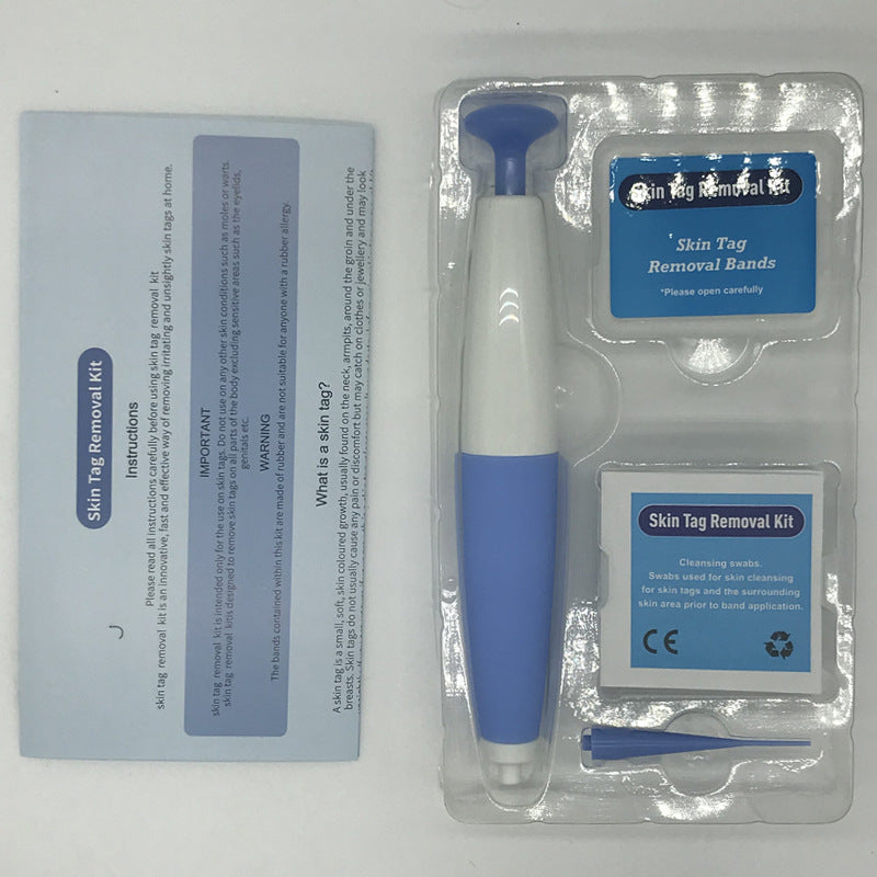Skin tag removal kit with tool and accessories on a white background