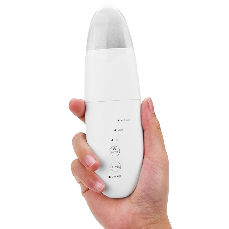 Hand holding a white electronic device with buttons on a white background