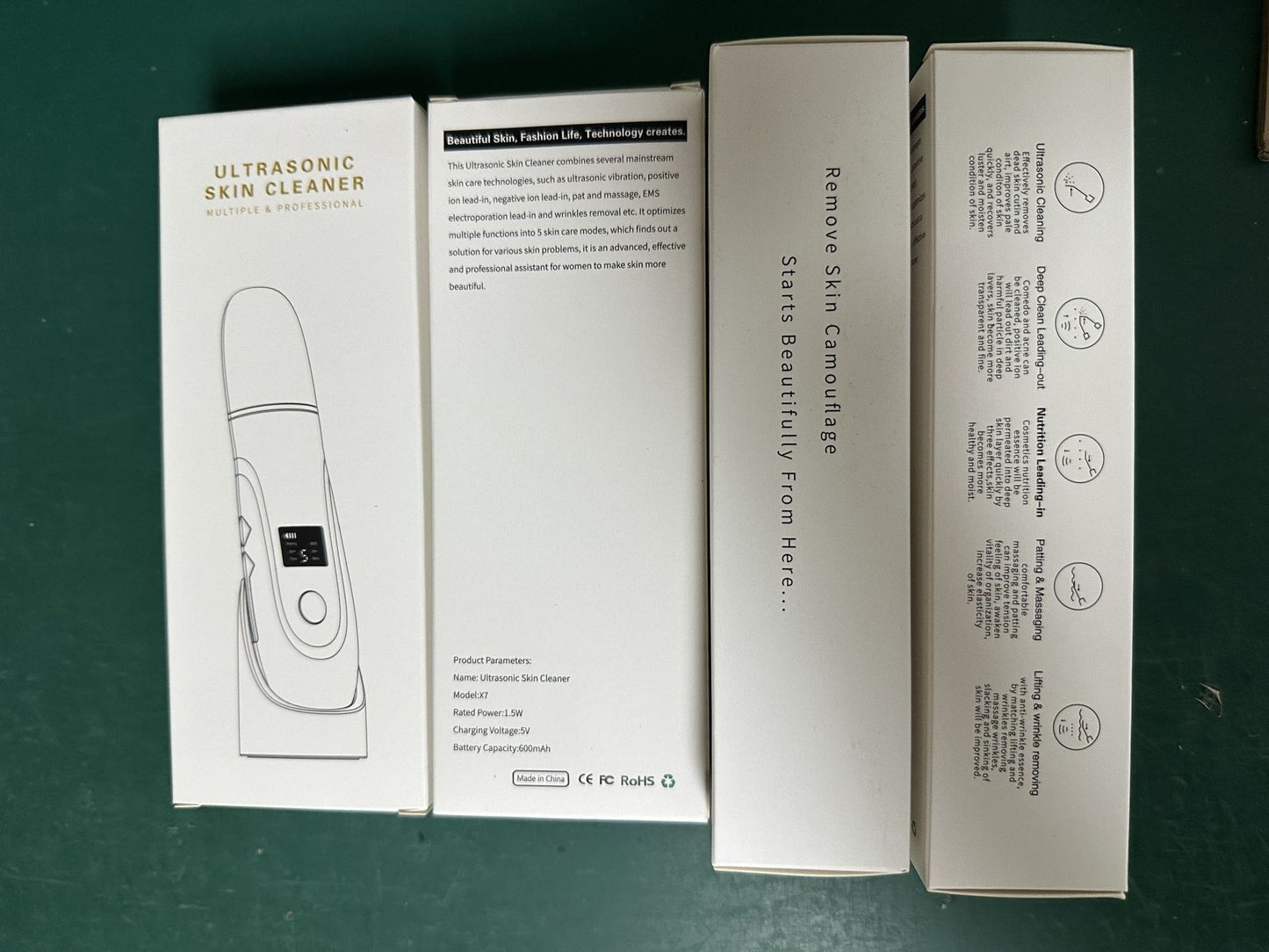Ultrasonic skin cleaner packaging on a green surface