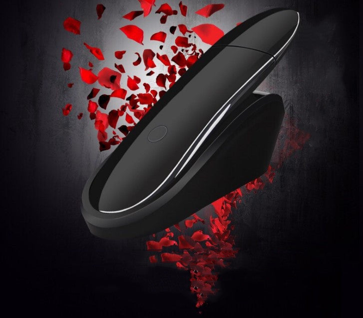 Black circular object with red破碎pieces on a dark background